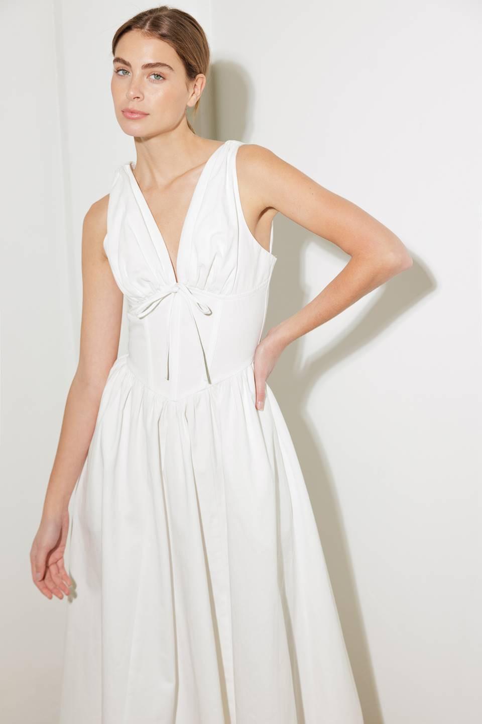 White Flying Tomato Fanciful Escapes woven midi dress with a flowy, patterned fabric and sleeveless design on a mannequin.
