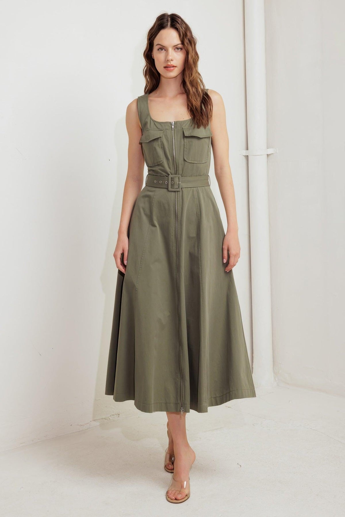 Flying Tomato Olive Grove Woven Midi Dress, sleeveless with a relaxed fit and olive green floral pattern, flowing midi length.