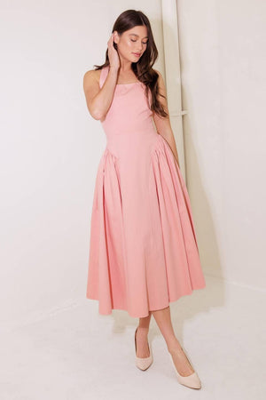 Pink woven midi dress from Flying Tomato, caught in the rain, showcasing soft fabric and stylish design.