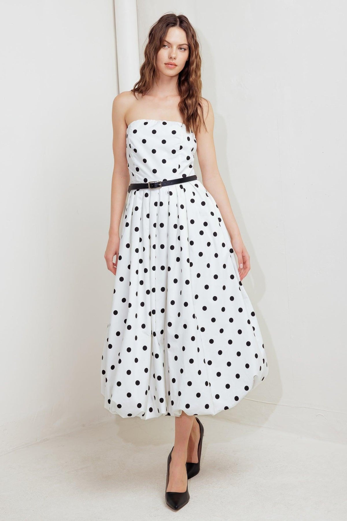 Flying Tomato Monroe Dot White Woven Midi Dress displayed on a hanger, showcasing its lightweight fabric and classic polka dot pattern.