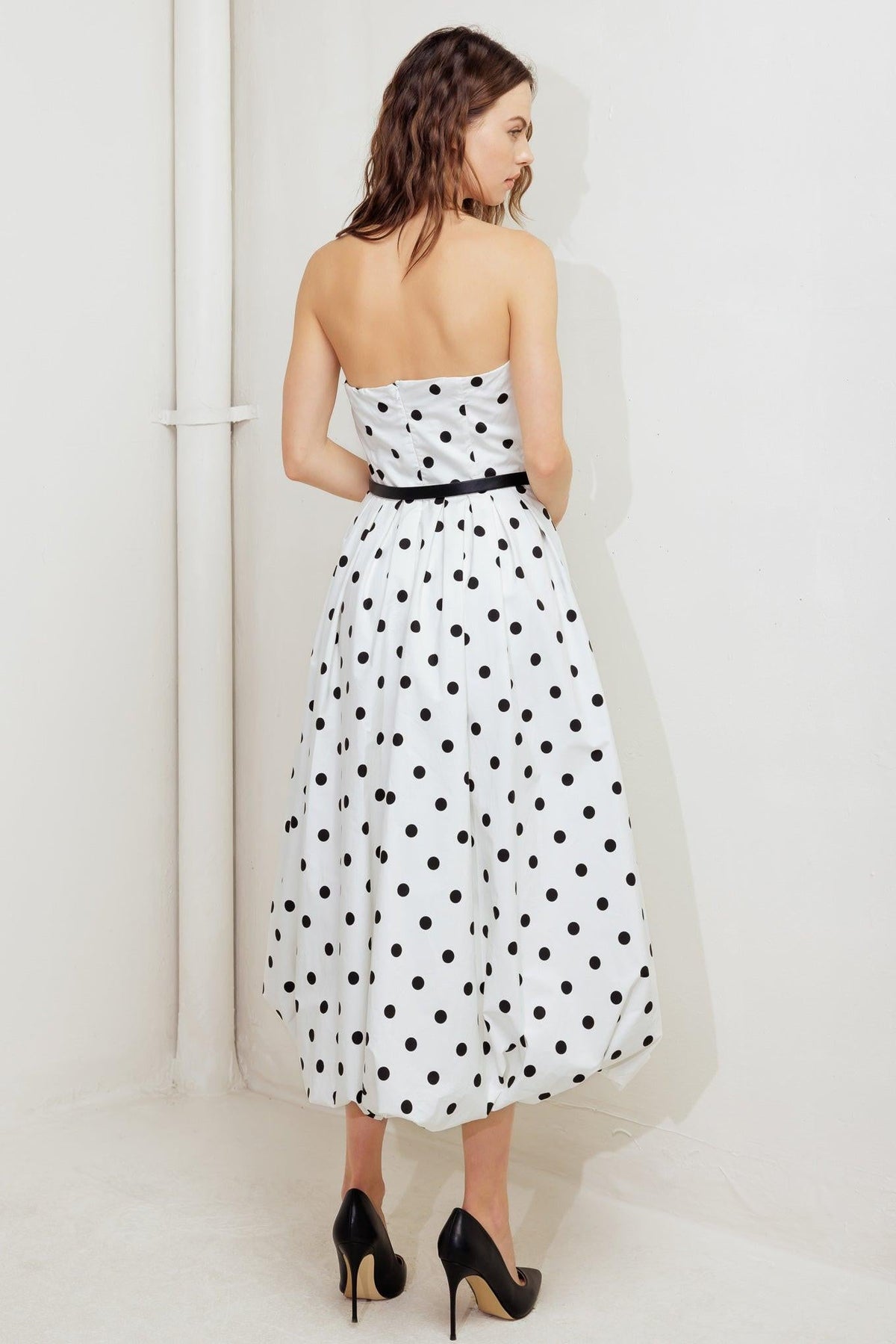 Flying Tomato Monroe Dot white woven midi dress with short sleeves and a fitted waist, hanging on a clothing rack.