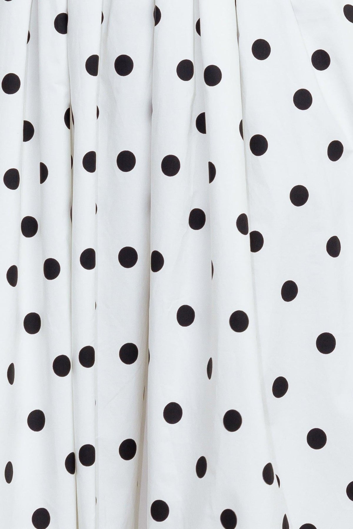 Flying Tomato Monroe Dot White Woven Midi Dress displayed on a hanger with a floral background and flowing fabric.