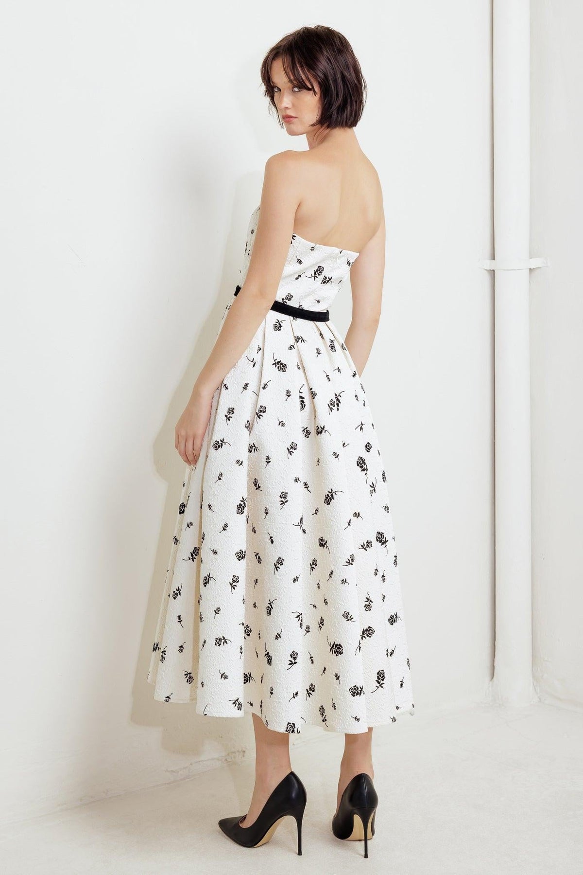 Cream and black woven midi dress by Flying Tomato, featuring a cultivated floral pattern and flowing silhouette.