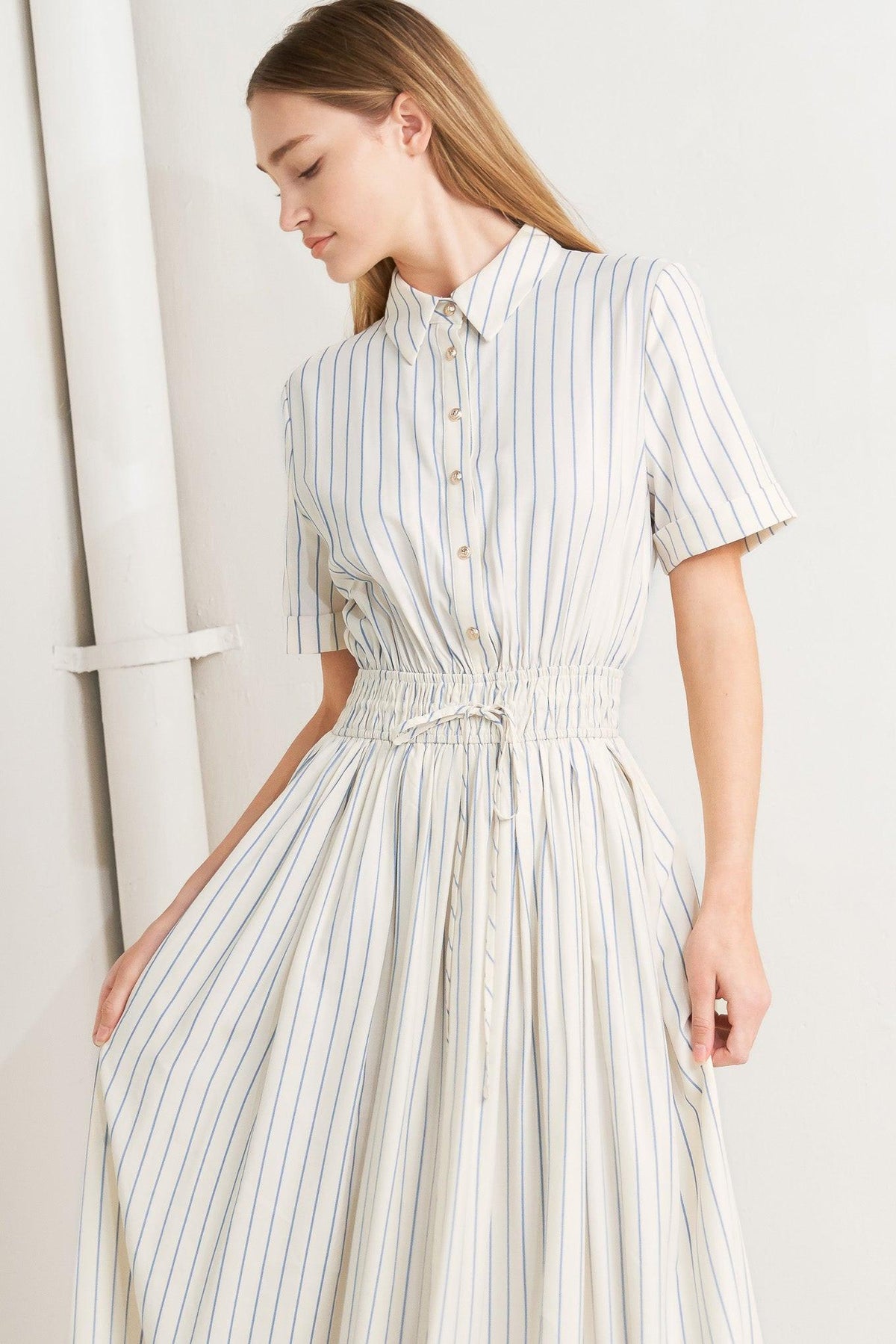 Flying Tomato Sunday Stripe Woven Midi Dress in ivory and blue, featuring a stylish striped pattern and flowing silhouette.
