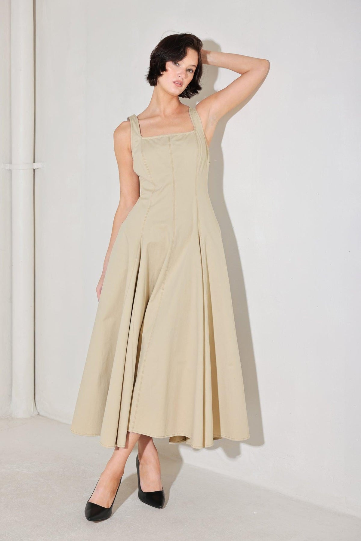 Beige Flying Tomato Sandstone Serene Woven Midi Dress with relaxed fit and intricate woven pattern, displayed on a hanger.