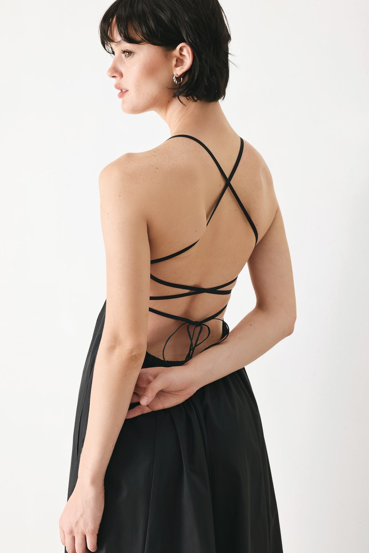 Flying Tomato PURE LINE woven midi dress in black, featuring a flowy fabric and a stylish, casual silhouette.