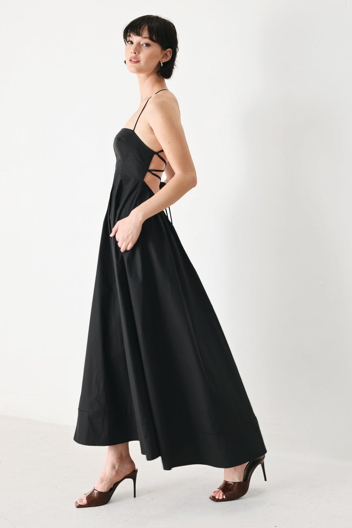 Flying Tomato PURE LINE woven midi dress in black, featuring a stylish, flowy fabric and a comfortable, elegant fit.