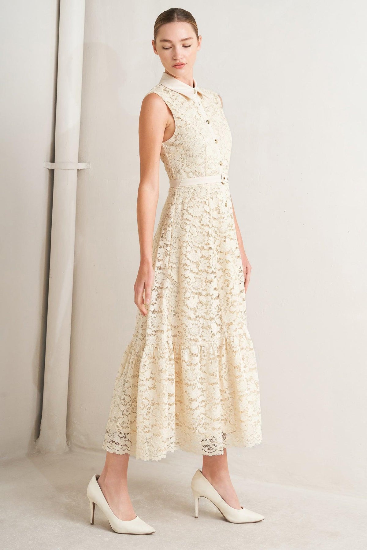 Cream woven lace midi dress by Flying Tomato featuring intricate lace details and a flowing silhouette.