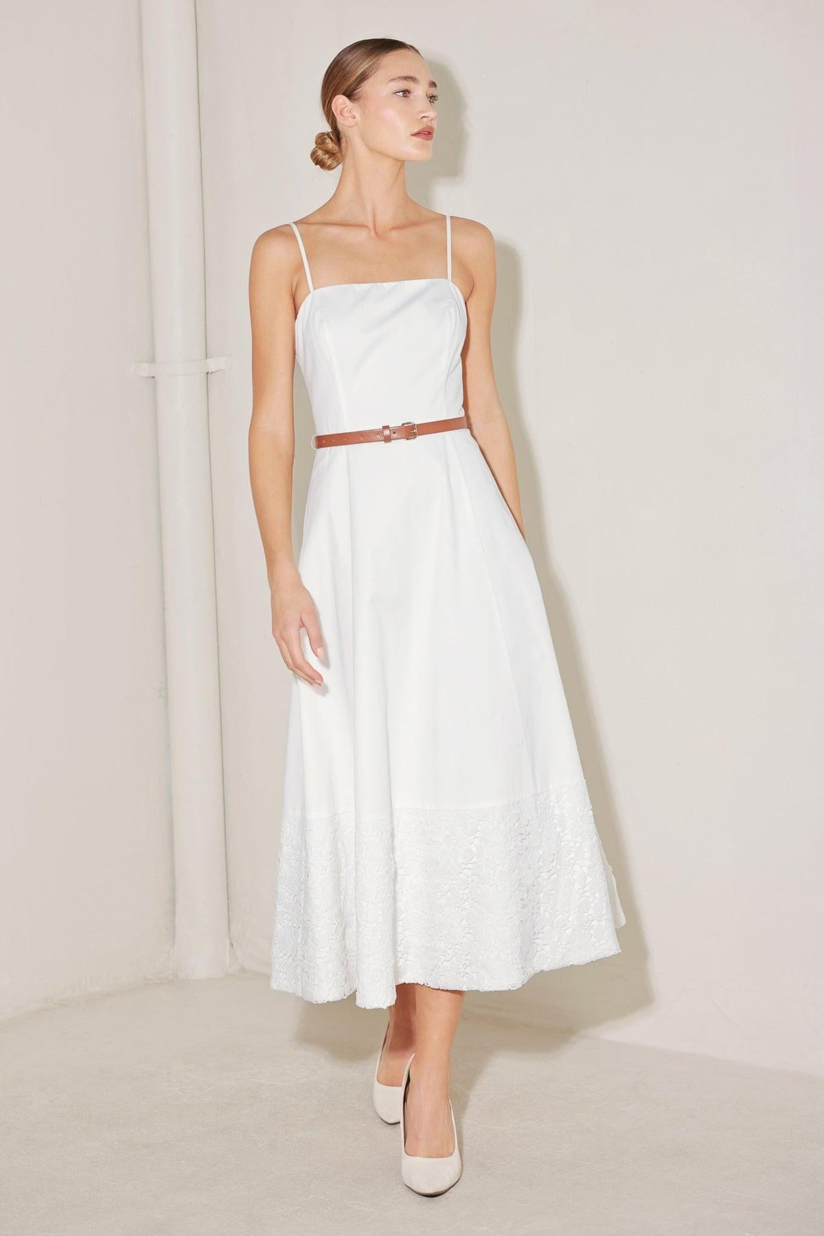 White woven midi dress from Flying Tomato's Delicate Icon collection, featuring a flowing, lightweight design and intricate fabric details.