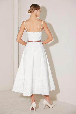 White woven midi dress from Flying Tomato's Delicate Icon collection, featuring a delicate, flowing design and sleeveless style.