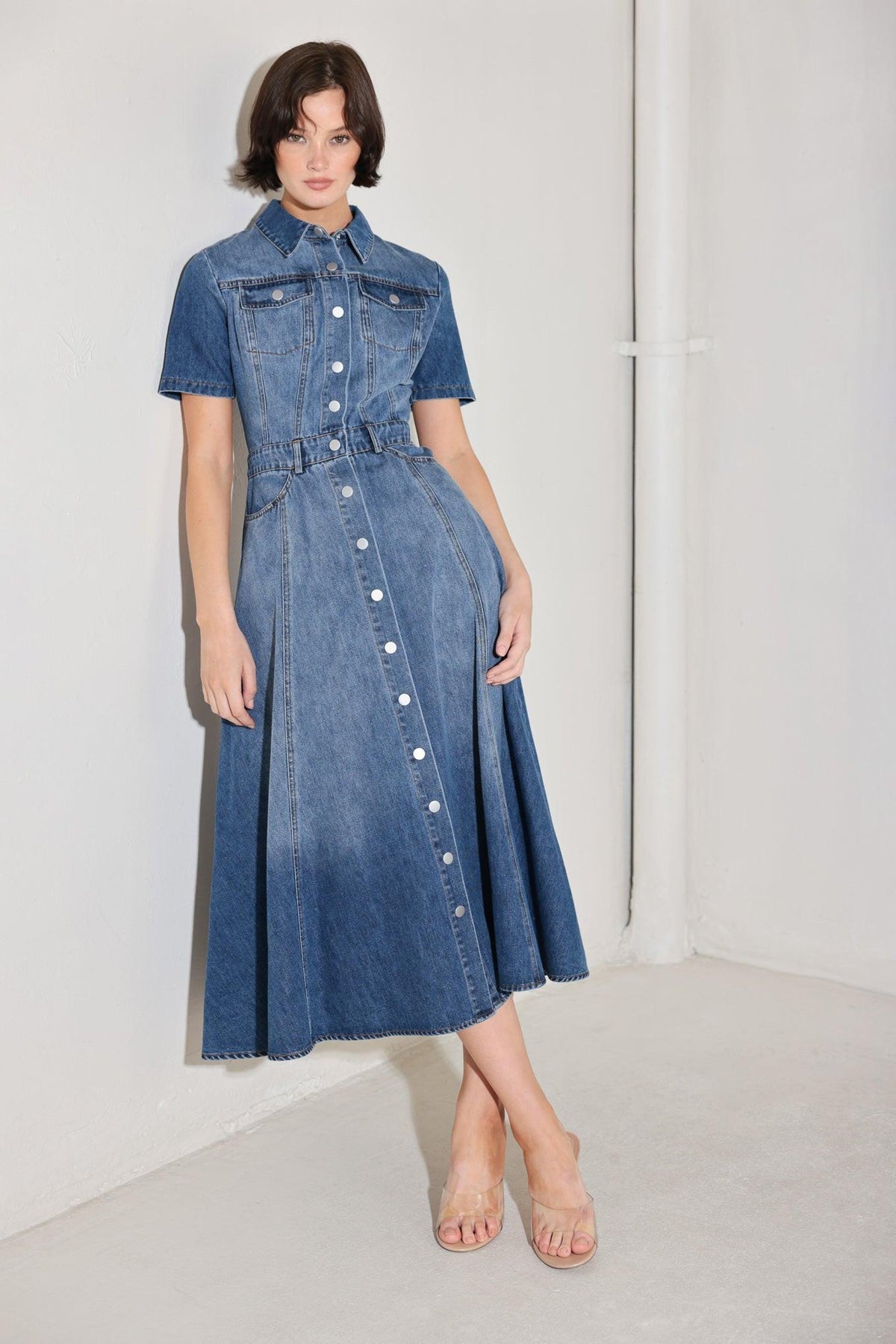 Flying Tomato Bluebird Promenade denim midi dress featuring a medium wash, sleeveless style, and a fitted waist.