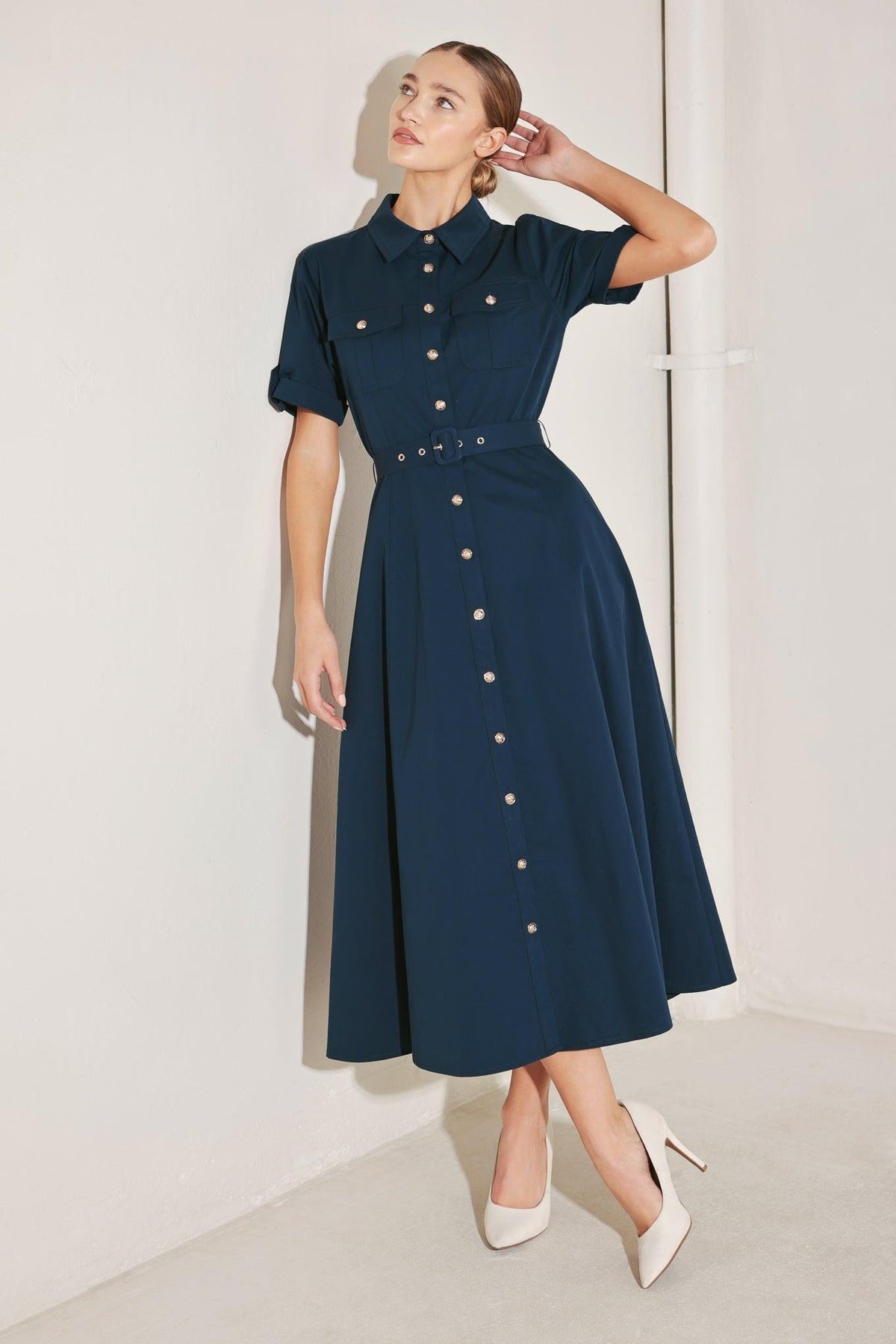 Flying Tomato Classic Authority woven midi dress in navy, with a fitted bodice and flowing skirt, displayed on a hanger.