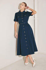 Flying Tomato Classic Authority woven midi dress in navy, with a fitted bodice and flowing skirt, displayed on a hanger.