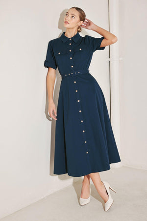 Flying Tomato Classic Authority woven midi dress in navy, with a fitted bodice and flowing skirt, displayed on a hanger.