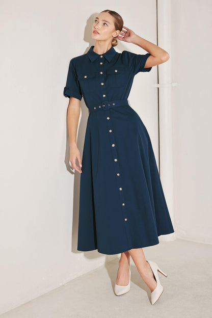 Flying Tomato Classic Authority woven midi dress in navy, with a fitted bodice and flowing skirt, displayed on a hanger.