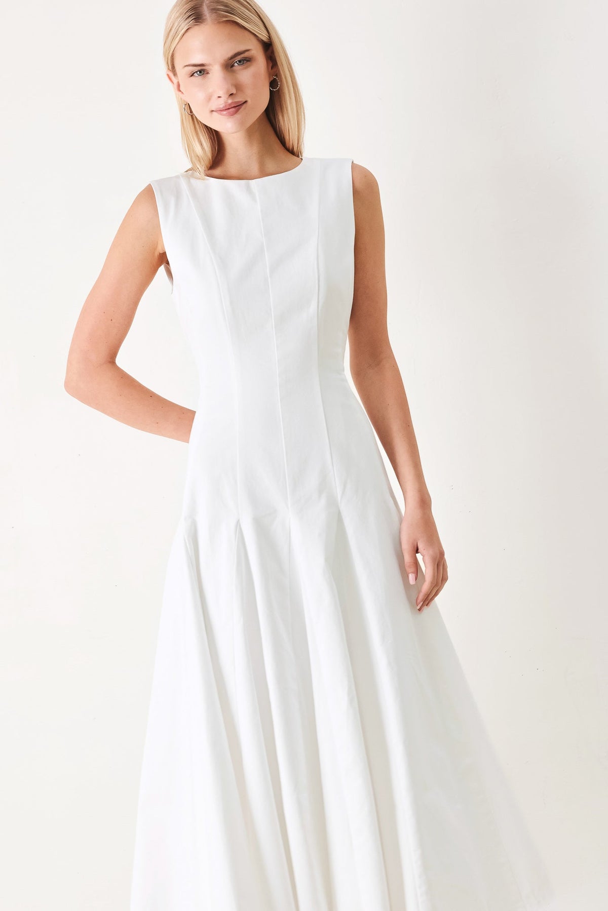 White woven midi dress by Flying Tomato featuring a fitted bodice and flowing skirt, perfect for casual or semi-formal occasions.