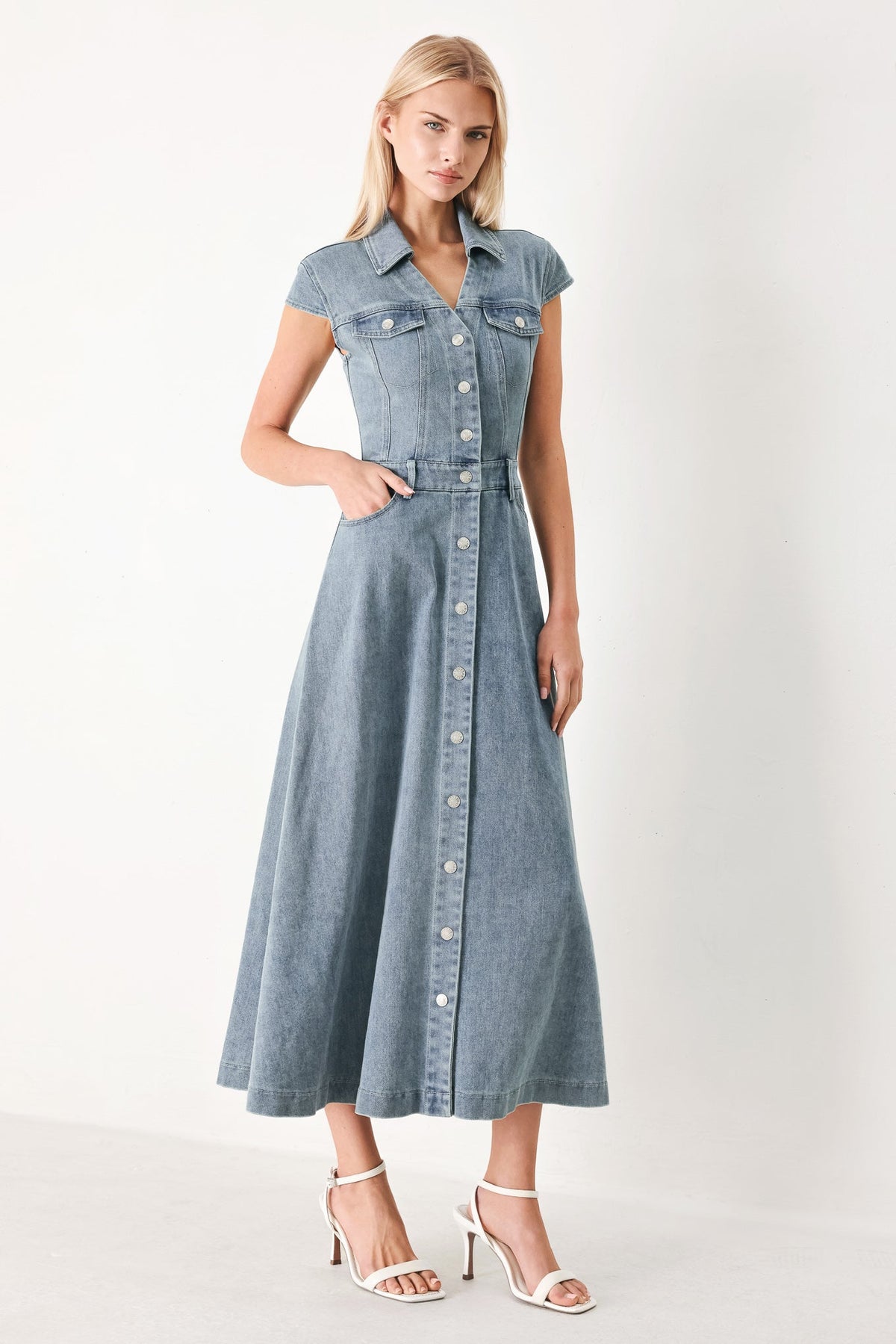 Light denim Flying Tomato Classic Flow Denim Midi Dress displayed on a hanger, showcasing its casual, flowy midi length and sleeveless design.