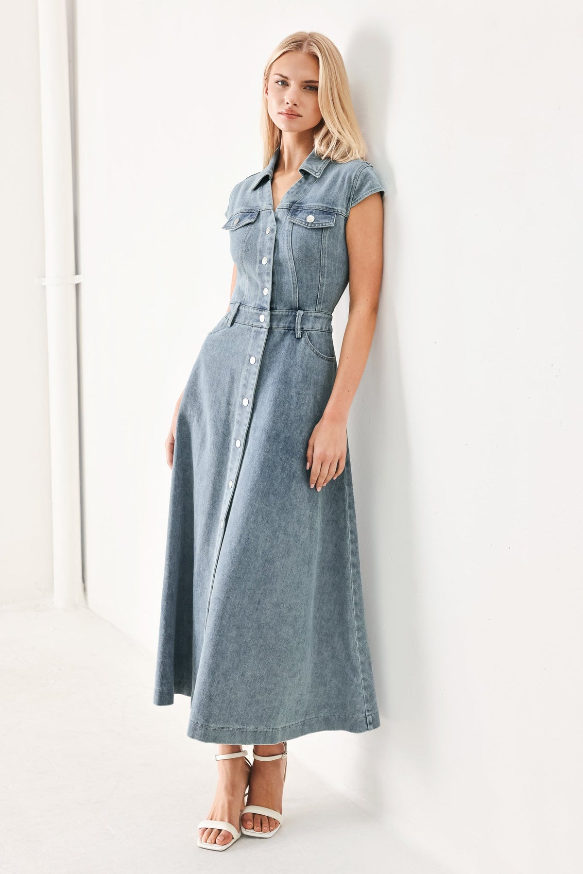 Light denim Flying Tomato Classic Flow Denim Midi Dress displayed on a hanger showing its relaxed fit and simple design.