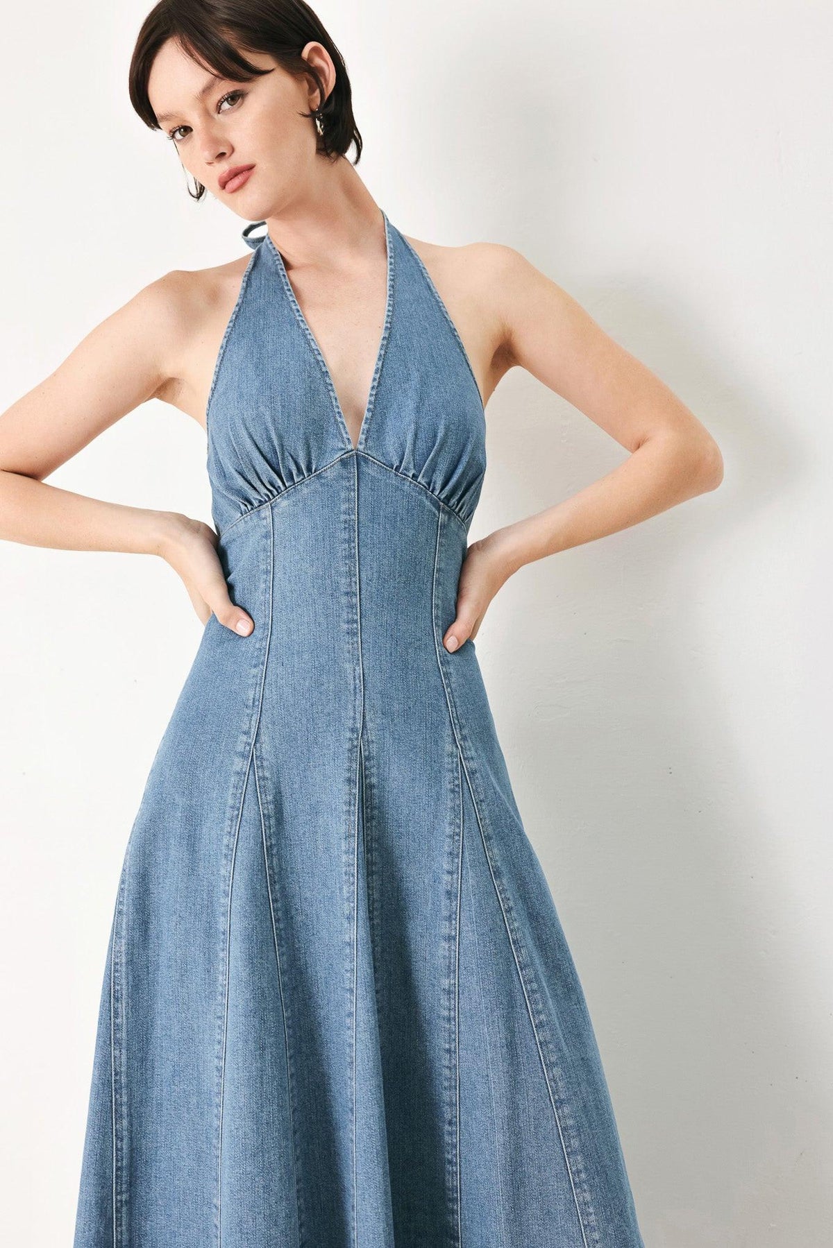 Flying Tomato blue blossom denim midi dress displayed on a hanger, featuring a classic denim design and mid-length cut.