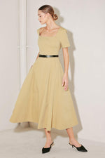 Beige woven midi dress from Flying Tomato's Warm Stone Edit collection, featuring a sleeveless design and stylish fit.