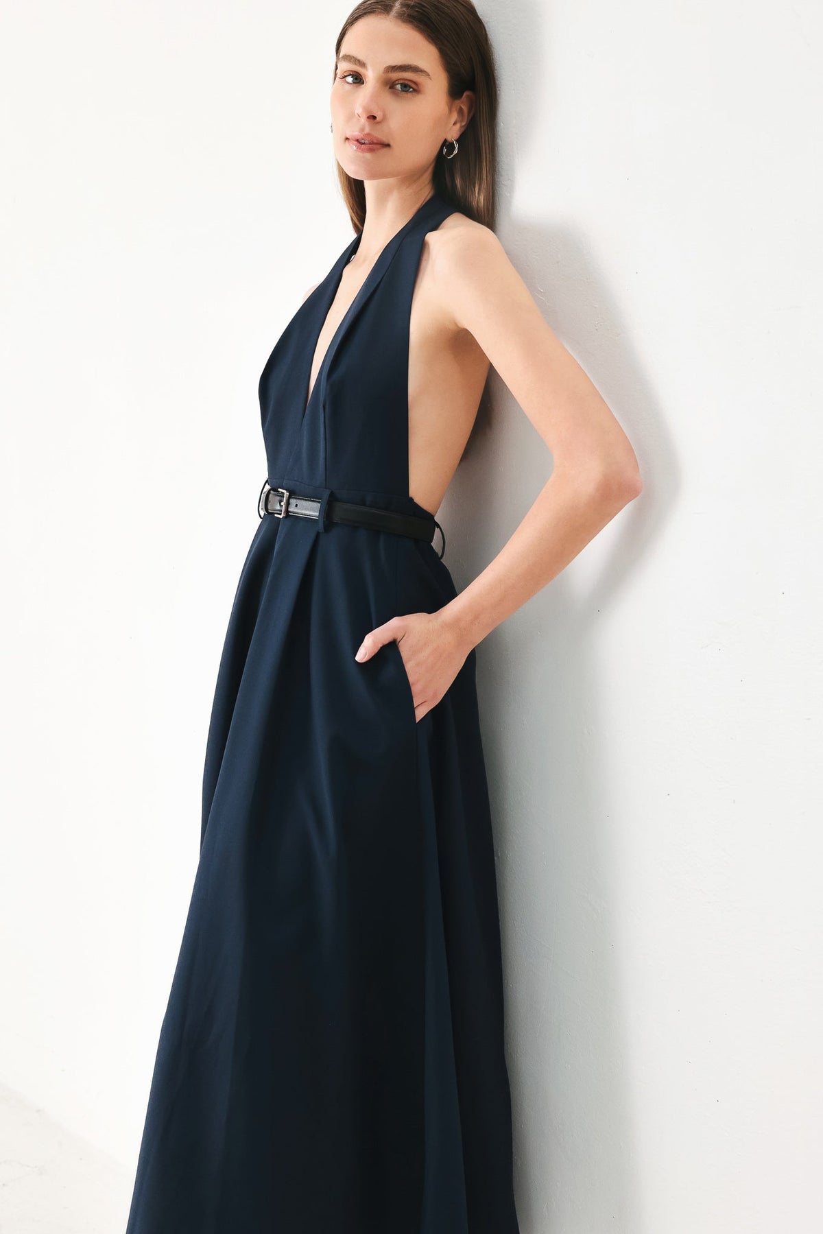 Flying Tomato Midnight Form Woven Midi Dress in navy, featuring a fitted waist and elegant midi length, displayed on a hanger.