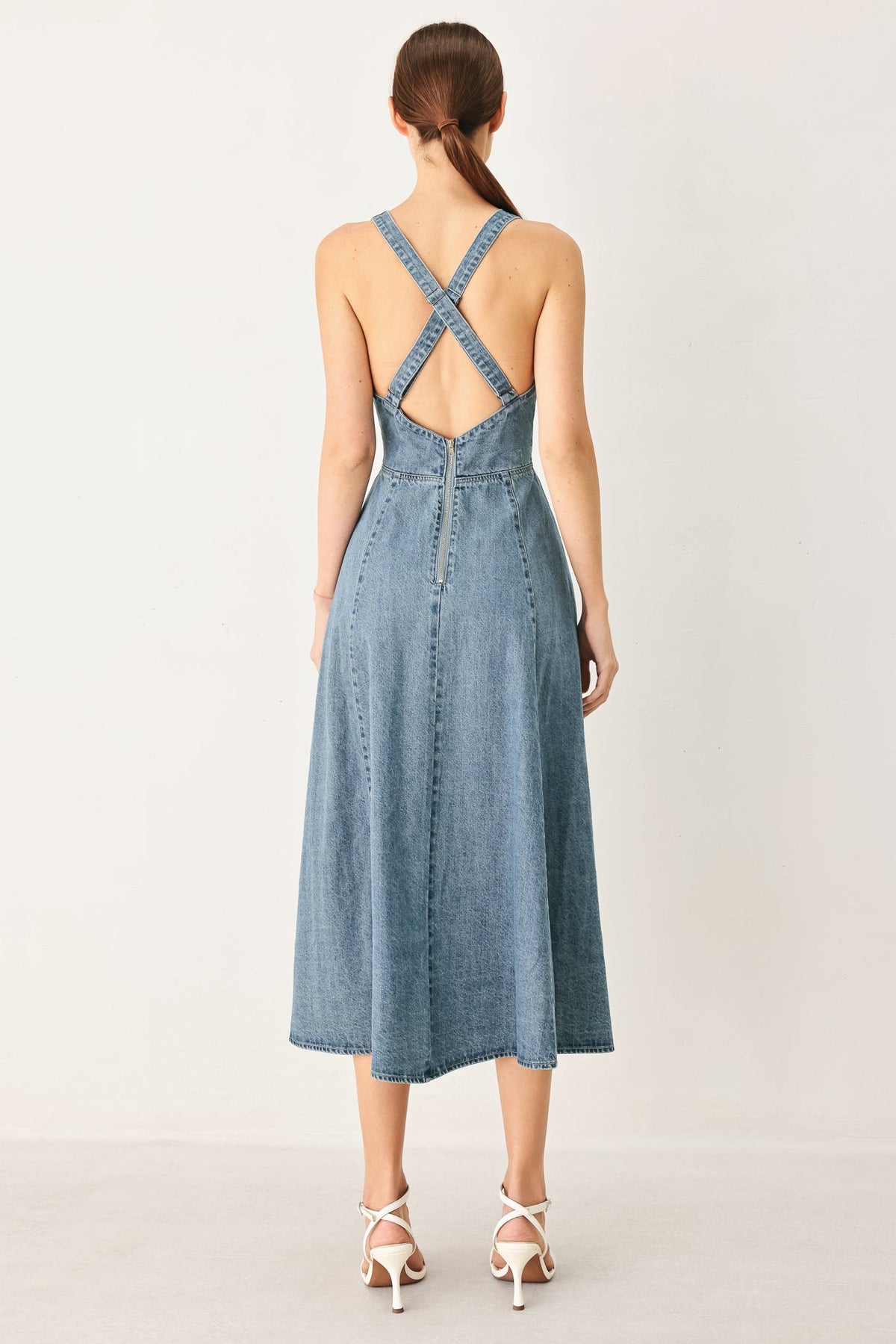 Light denim Flying Tomato Sunday Muse denim midi dress with sleeveless design and button-front detail.