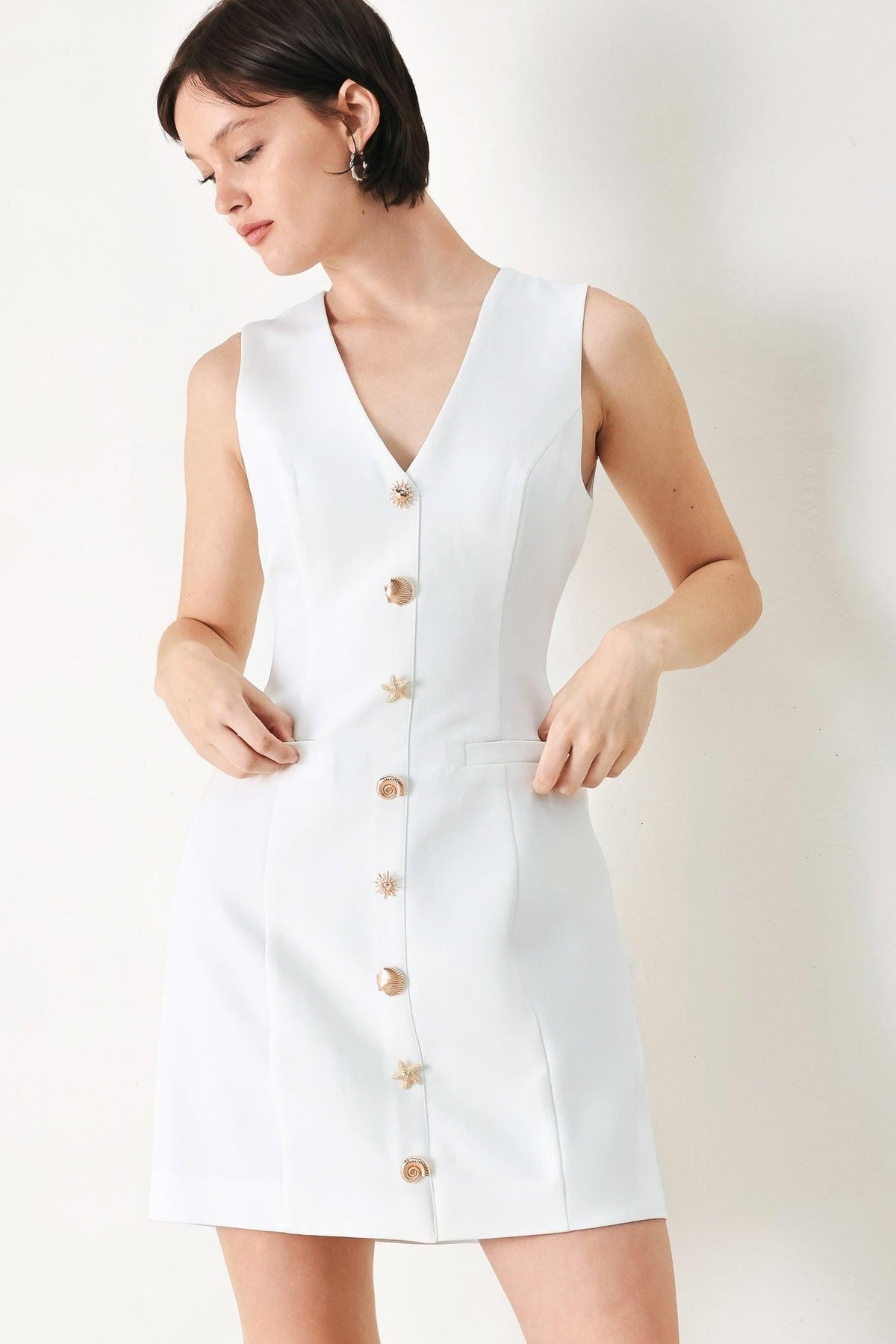 Off-white woven mini dress by Flying Tomato featuring a stylish, fitted design with short sleeves and a flattering silhouette.