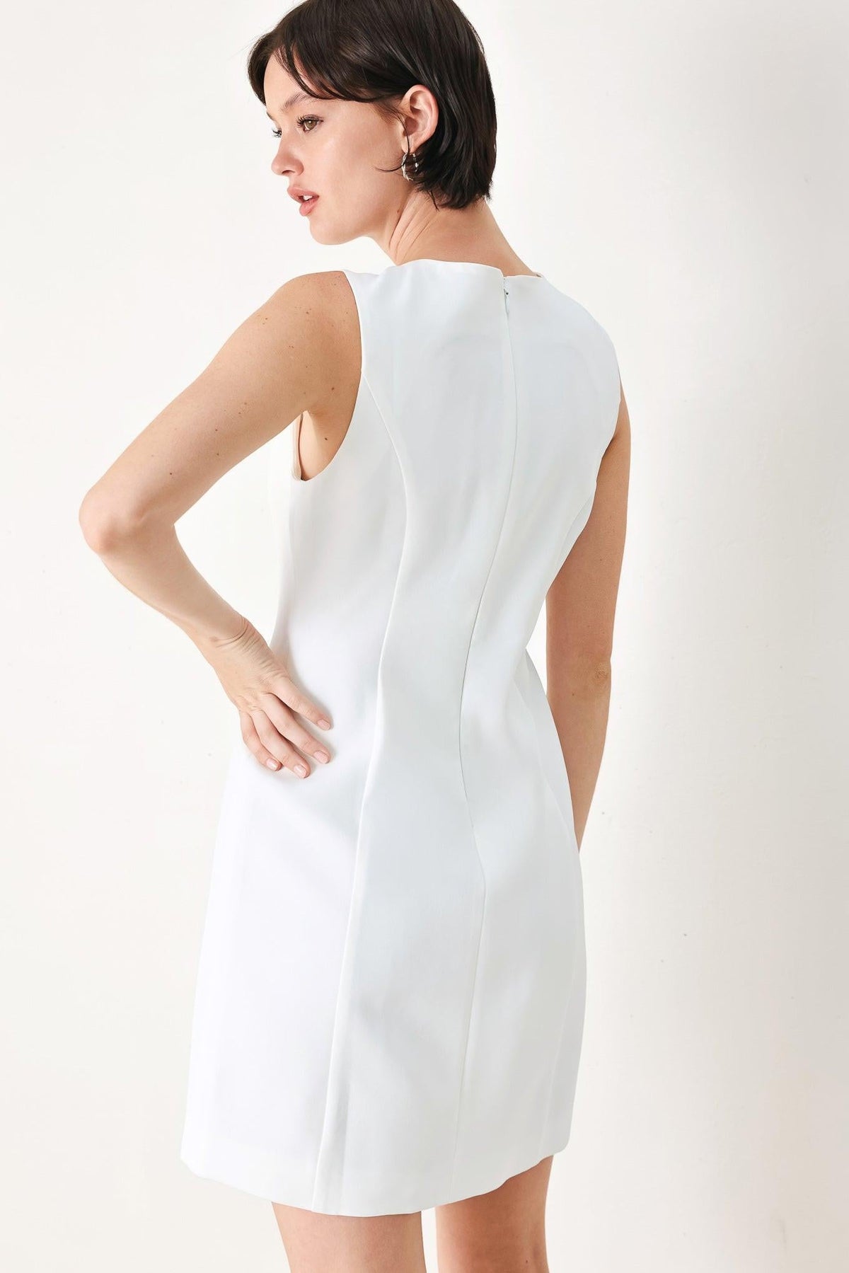 Off-white Flying Tomato Pure Glam woven mini dress with short sleeves and a fitted silhouette.