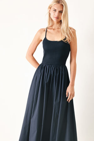 Flying Tomato Easy Breeze navy woven midi dress displayed on a hanger, showcasing its flowy fabric and stylish design.