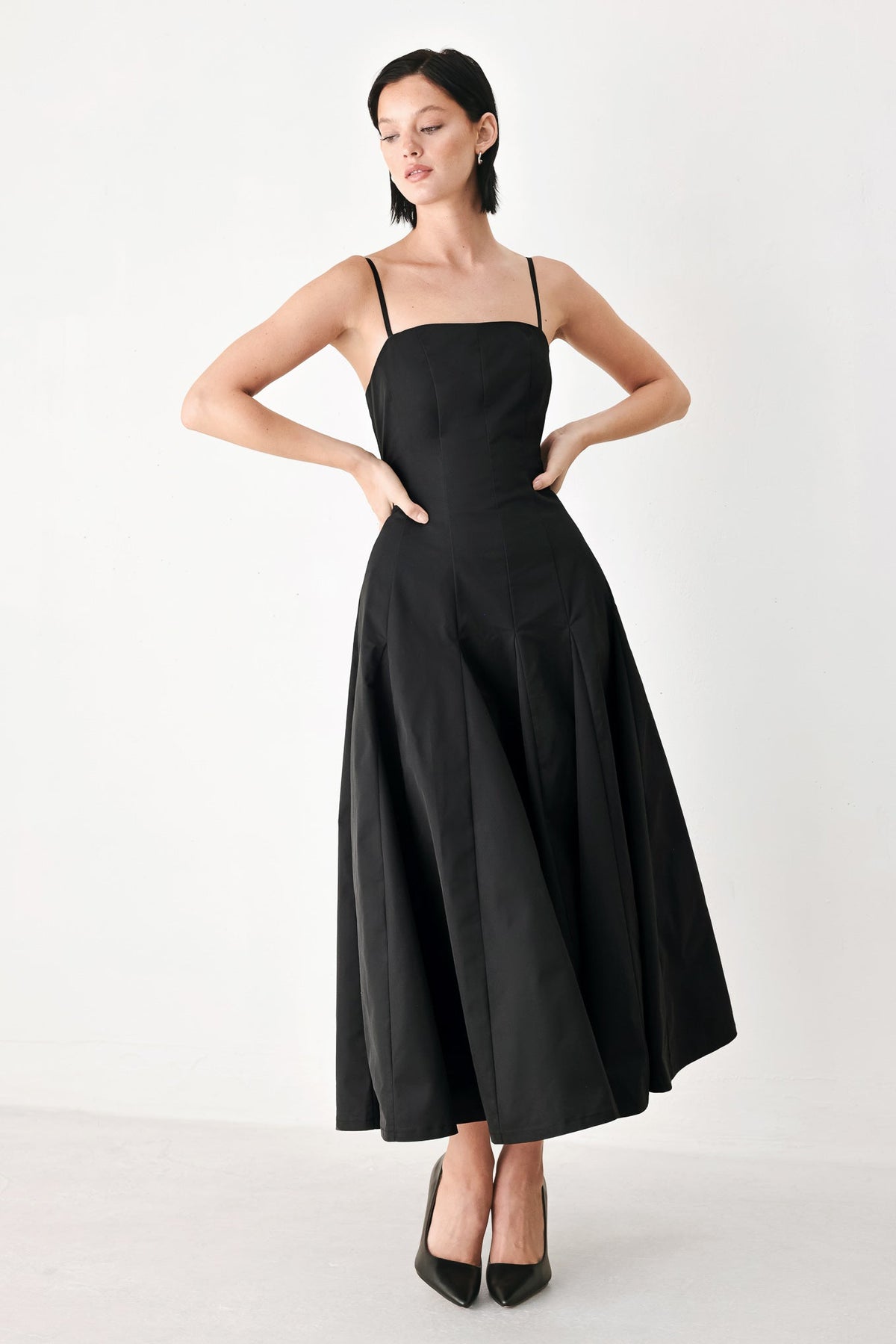 Black Timeless Romance midi dress by Flying Tomato showing elegant fit and flowy skirt on a model.