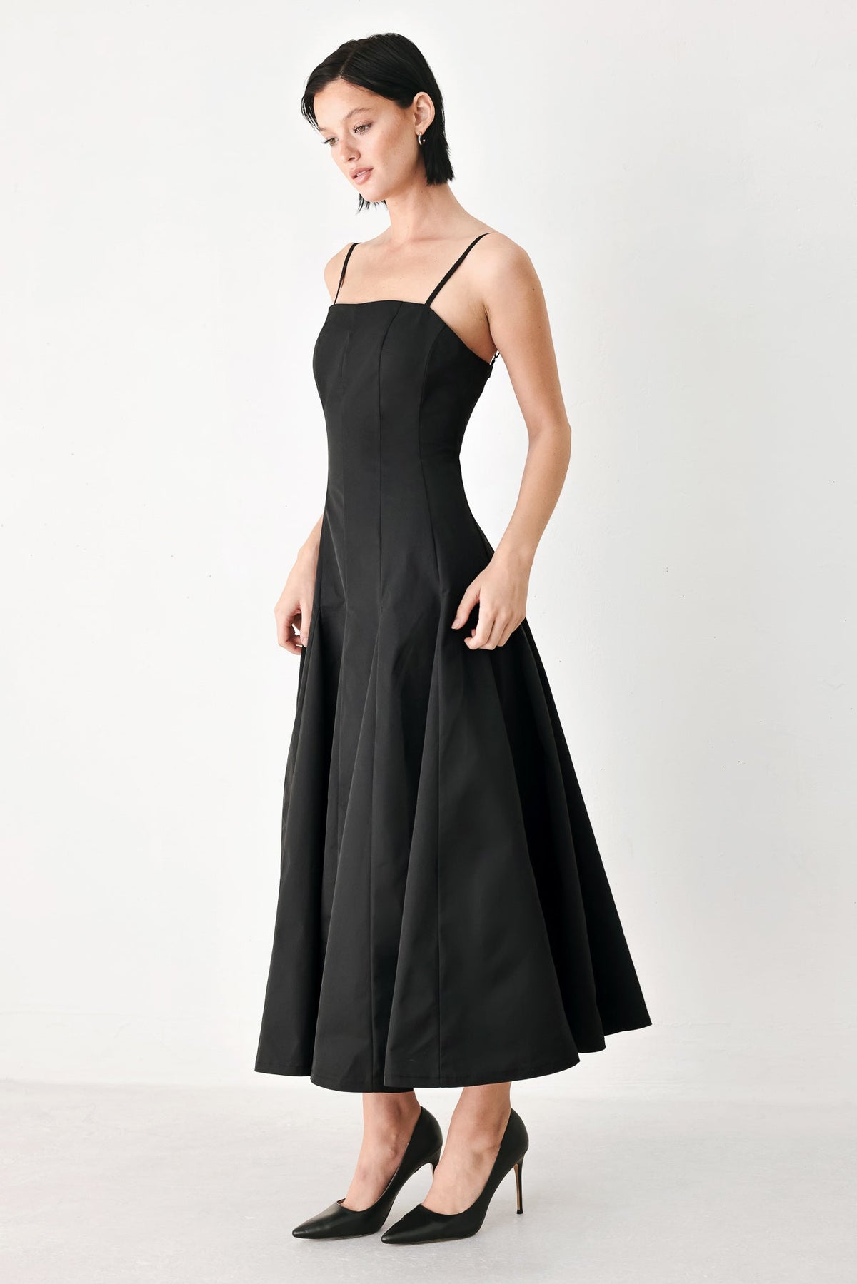 Black Flying Tomato Timeless Romance midi dress with a fitted bodice and flowing skirt, displayed on a hanger.