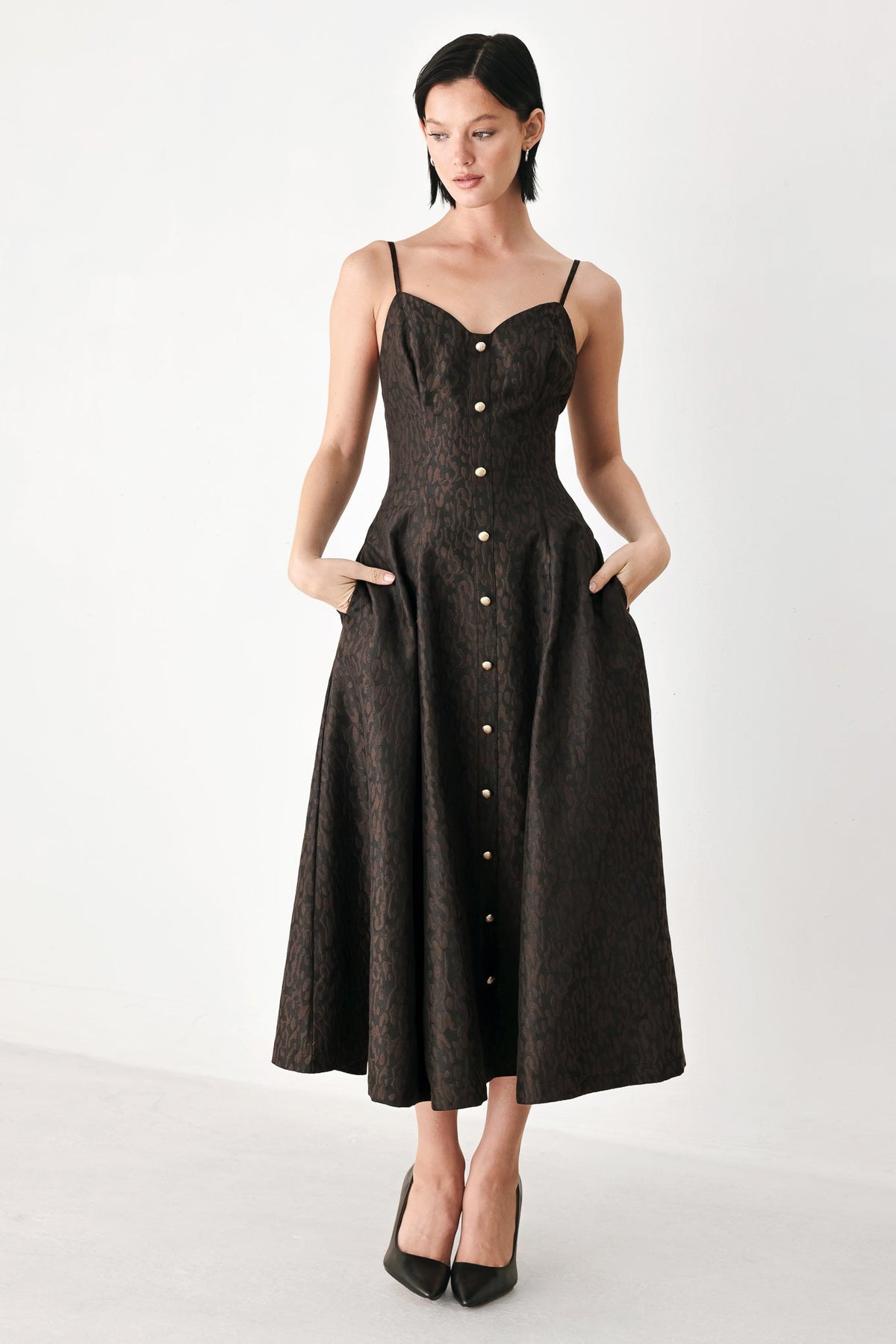 Flying Tomato chocolate sweetheart midi dress with button details, sleeveless design, and fitted waist in brown and black fabric.
