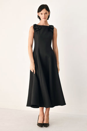 Black Tied to Tonight Bow Shoulder midi dress by Flying Tomato, featuring bow details on the shoulder and a sleek, midi-length silhouette.