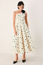 Cream and black one-shoulder bow midi dress by Flying Tomato, featuring elegant design and fitted silhouette.