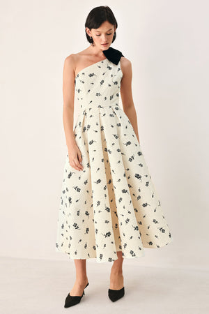 Cream and black one-shoulder bow midi dress by Flying Tomato, featuring elegant design and fitted silhouette.