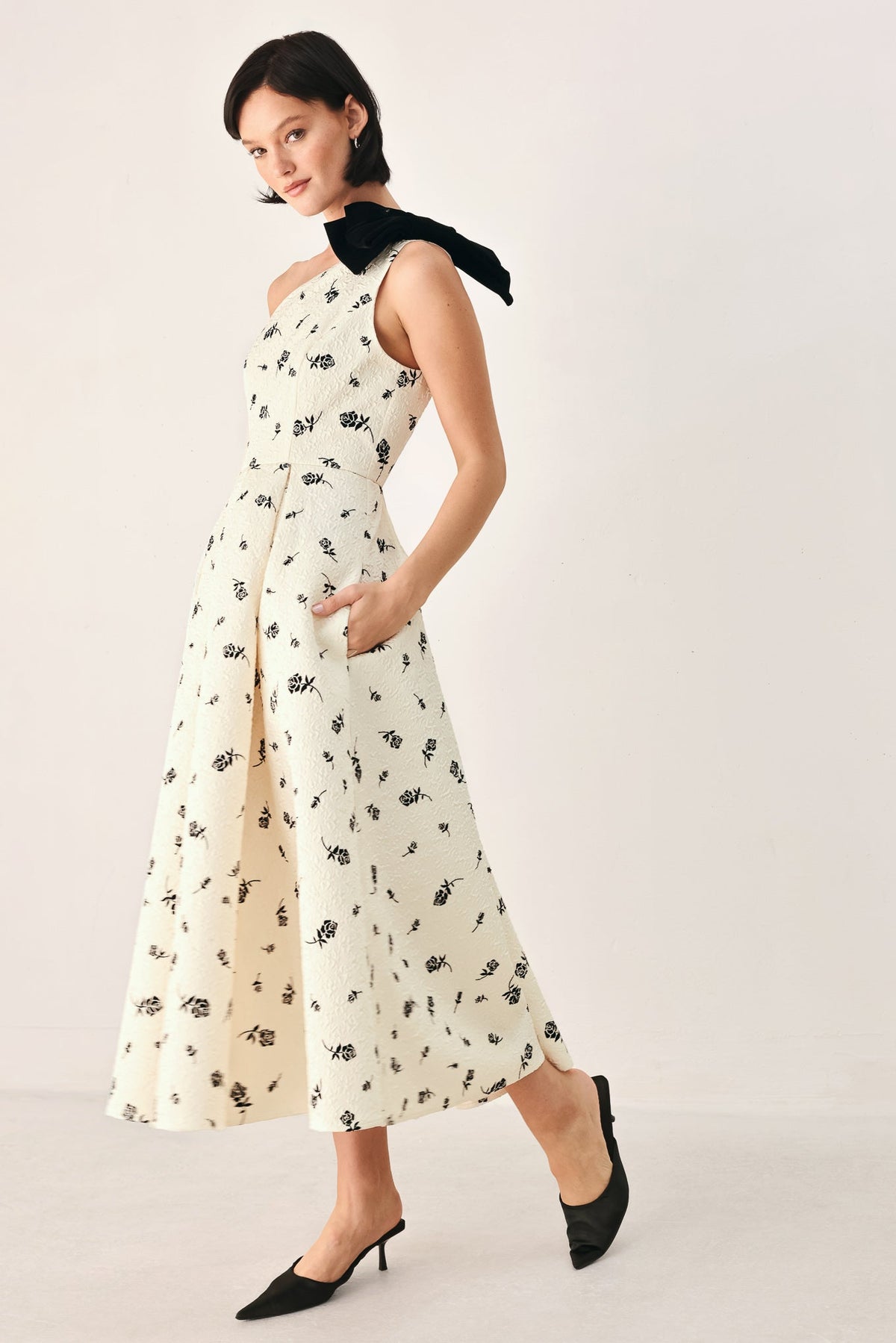 Cream and black one-shoulder bow midi dress by Flying Tomato, featuring a sleek silhouette and elegant design.