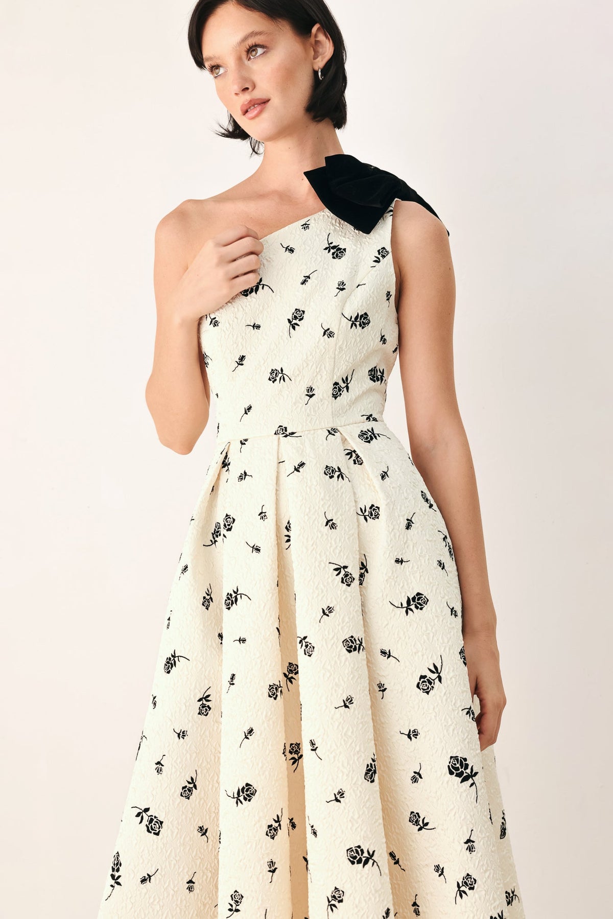 Cream and black one-shoulder bow midi dress by Flying Tomato featuring a fitted silhouette and elegant design.