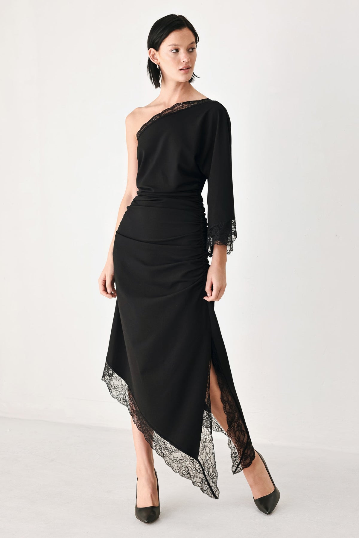Black Flying Tomato After Hours lace trim asymmetric midi dress with elegant lace details and a flowing silhouette.