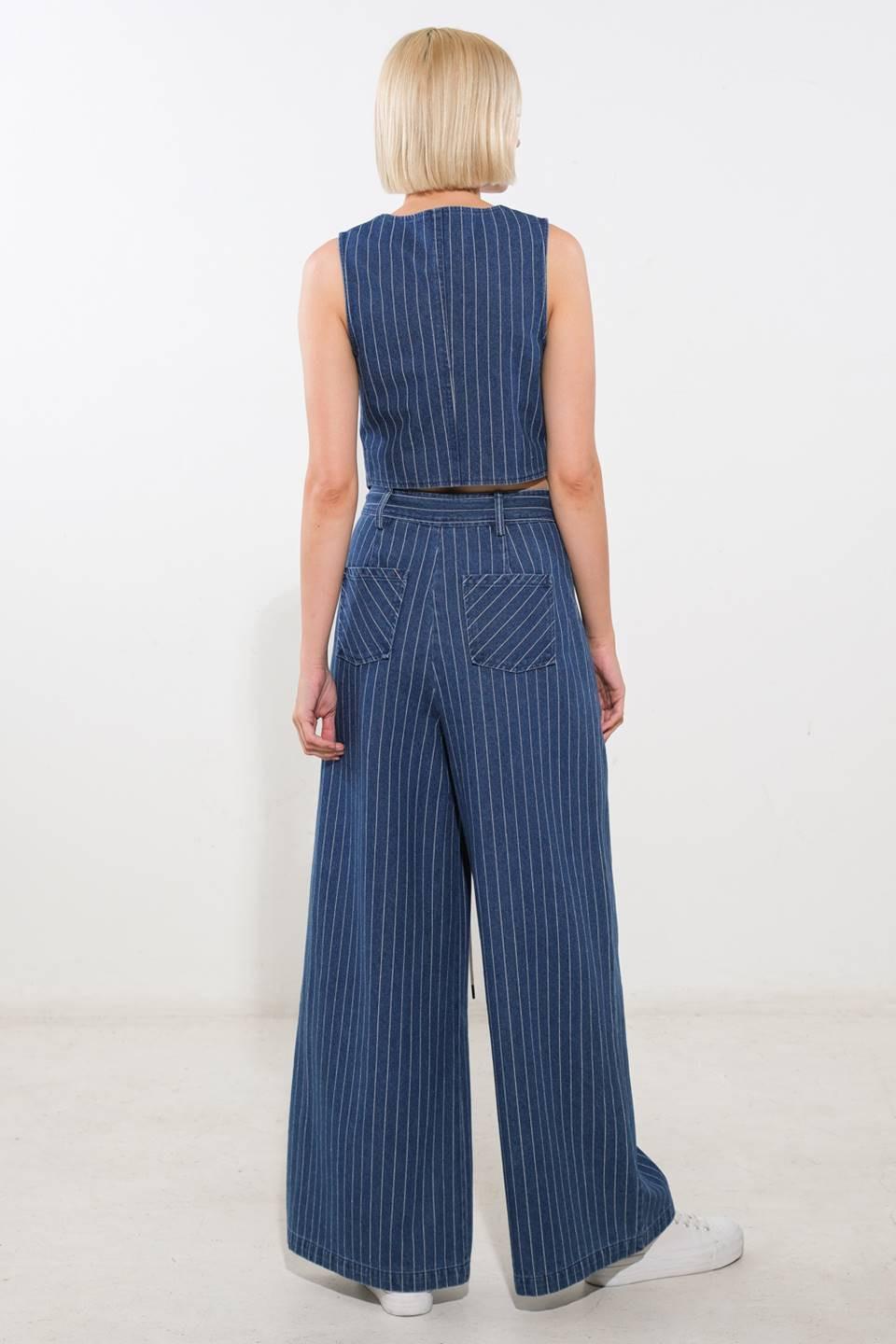 Medium indigo Flying Tomato I Still Believe denim vest, a stylish sleeveless denim top with front pockets and button closure.