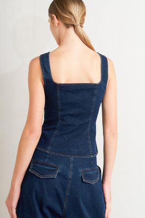 Flying Tomato Quiet Luxe denim top, casual sleeveless shirt with button front and fitted style, displayed on a hanger.