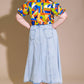 Light wash urban cowgirl denim midi skirt by Flying Tomato, featuring a high waist and classic denim styling.