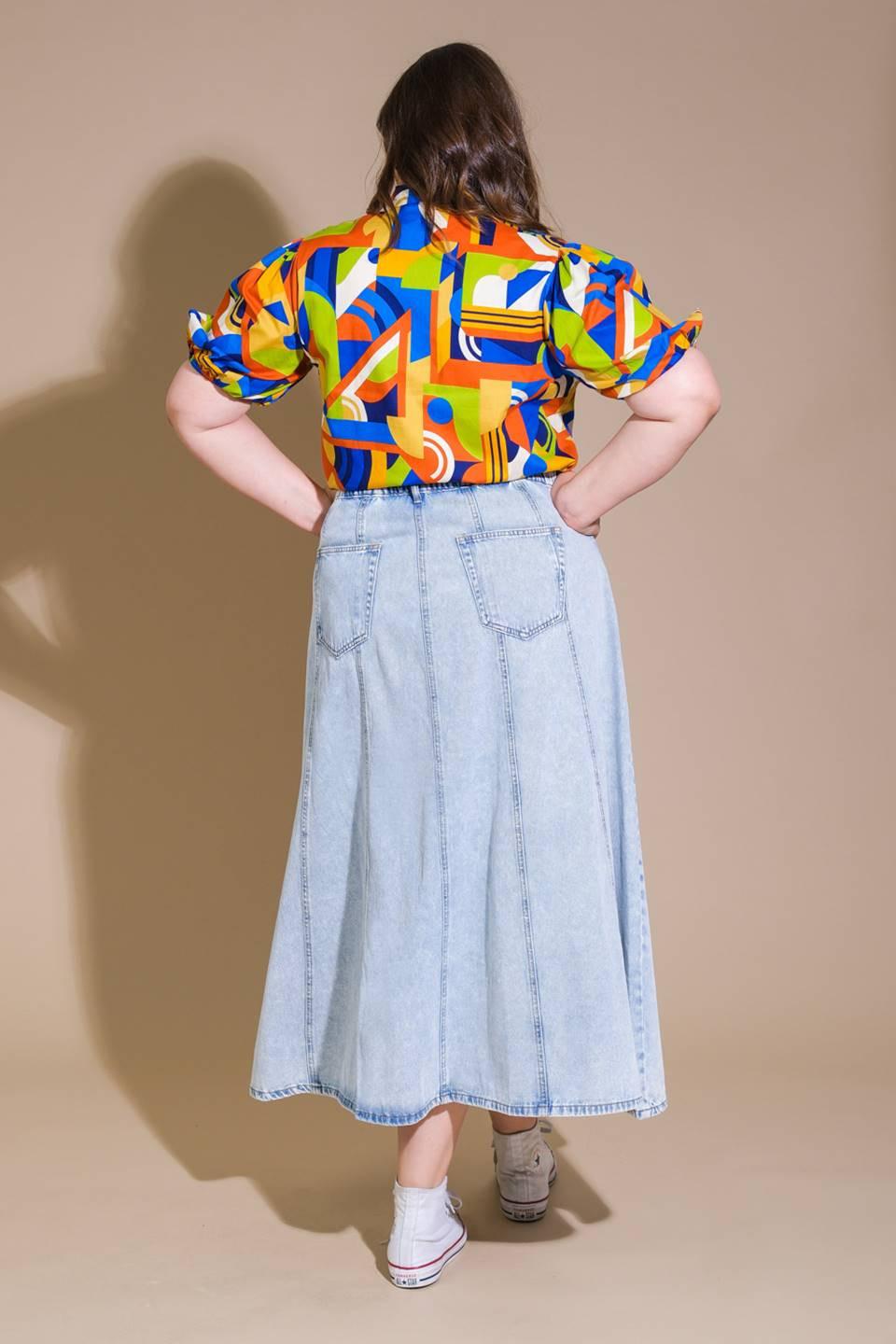 Light wash urban cowgirl denim midi skirt by Flying Tomato, featuring a high waist and classic denim styling.