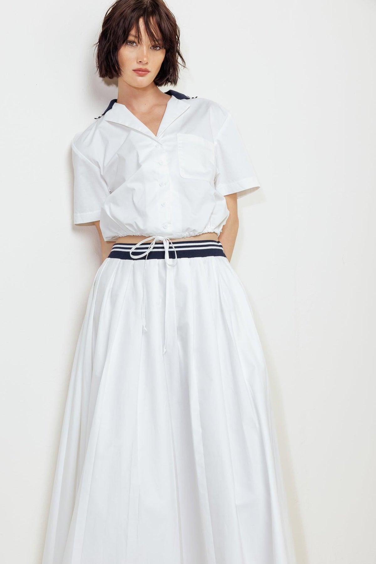 White Coastal Collar Woven Midi Skirt by Flying Tomato, featuring a flowy fabric and a stylish collar detail.