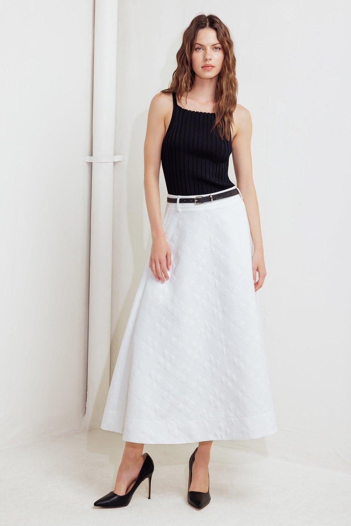 Flying Tomato Downtown Ease woven midi skirt in white, showing a flowy, textured fabric with a high waist and midi length.