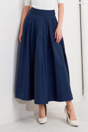 Navy woven pleated midi skirt from Flying Tomato with flare design and elegant pleats, styled for a fashionable look.