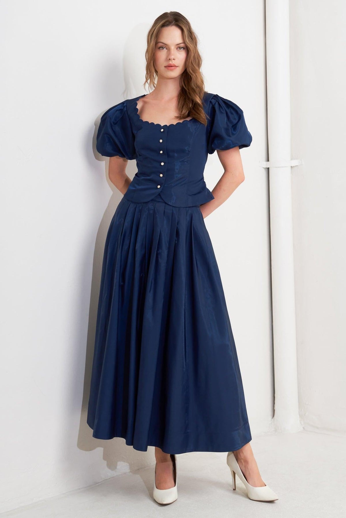 Navy blue Luxe Flare Woven Pleated Midi Skirt by Flying Tomato, showing the flowing pleated design and mid-length fit.