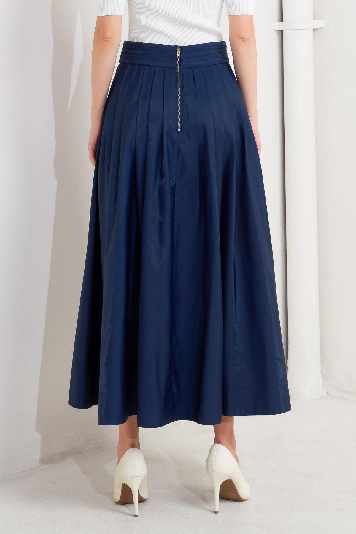 Navy woven flare pleated midi skirt by Flying Tomato, showing the flowing fabric and elegant pleats.