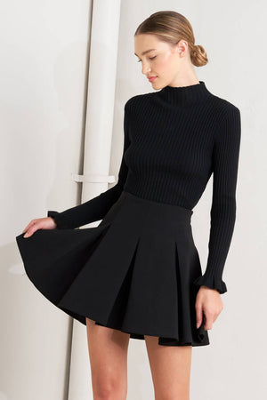 Black woven mini skirt from Flying Tomato featuring a stylish, fitted design with a high waist and textured fabric.