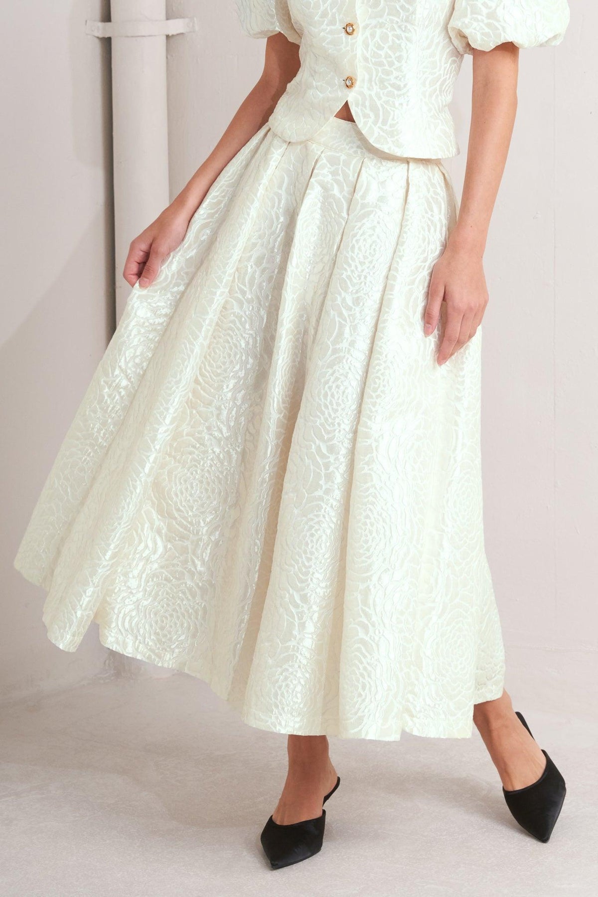 Cream-colored ROSÉ Texture Woven Full Midi Skirt by Flying Tomato, showcasing its detailed woven fabric and flowing silhouette.