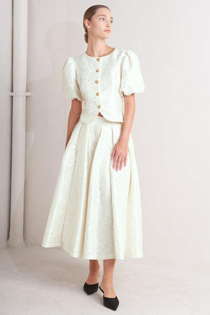 Cream-colored Flying Tomato rosé texture woven full midi skirt with a flowy, textured fabric and waistline detail.